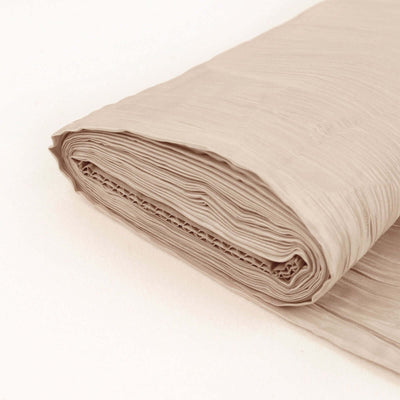 Rolled beige fabric showcasing smooth texture and elegant drape.