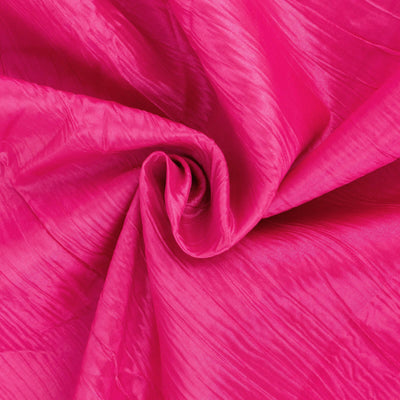 Bright pink textured fabric swirl, showcasing vibrant color and sheen.