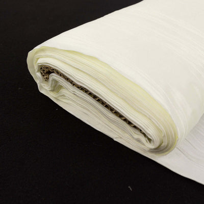 Roll of cream fabric with a smooth finish, ideal for sewing projects.