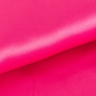 Vibrant pink fabric with a smooth texture and subtle sheen.