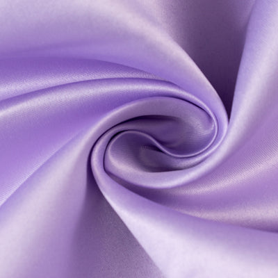 Smooth lavender satin fabric in a swirling pattern.