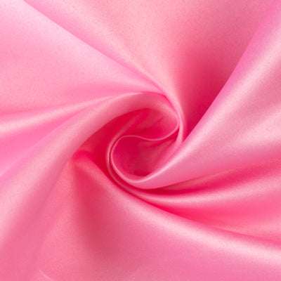 Pink satin fabric with a smooth texture and sheen.