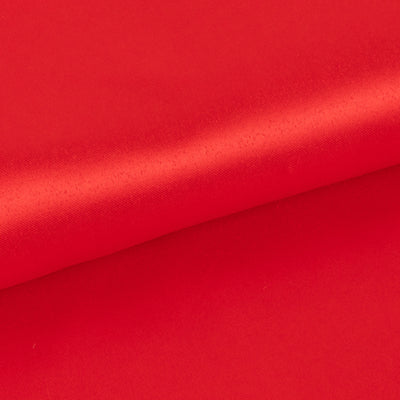 Red fabric texture close-up, showcasing vibrant color and smooth finish.