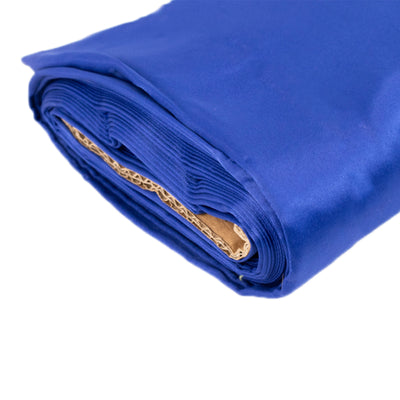 Rolled blue fabric on a plain background.