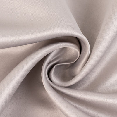 Silky textured fabric in a soft, neutral tone.