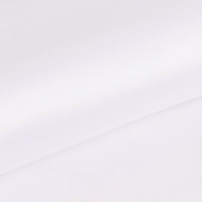 White smooth fabric draped elegantly on a plain surface.