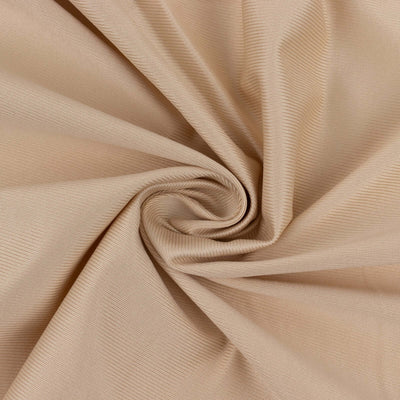 Beige textured fabric with a smooth, swirling pattern.