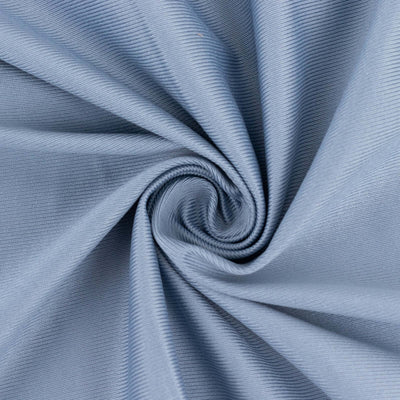 Light blue textured fabric swirl close-up shot.