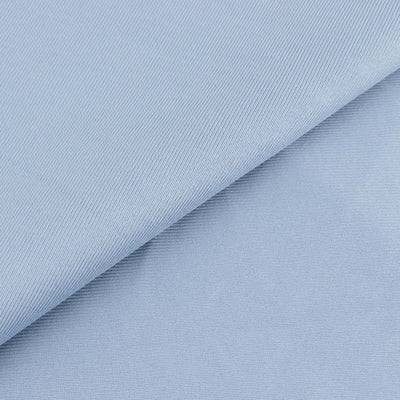 Light blue textured fabric close-up for sewing and crafting projects.