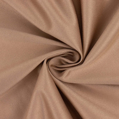 Textured beige fabric with a rippled pattern.