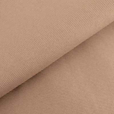 Textured beige fabric sample showcasing fine ribbing details.