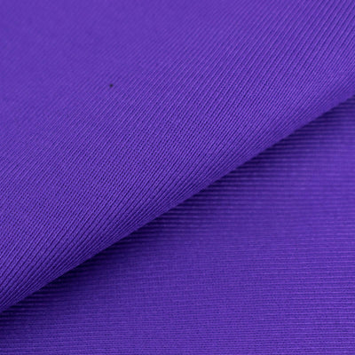 Purple textured fabric close-up showing ribbed detail.