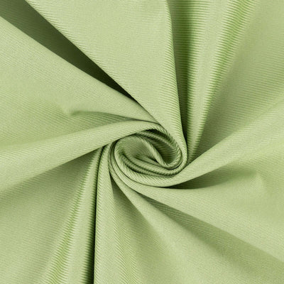 Light green textured fabric in a spiral arrangement.