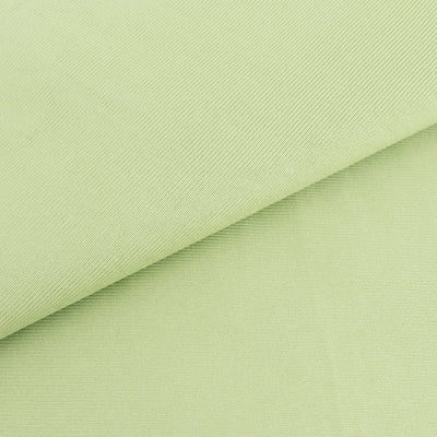 Light green textured fabric close-up for design and sewing projects.