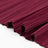 Burgundy pleated fabric close-up texture with folded edges