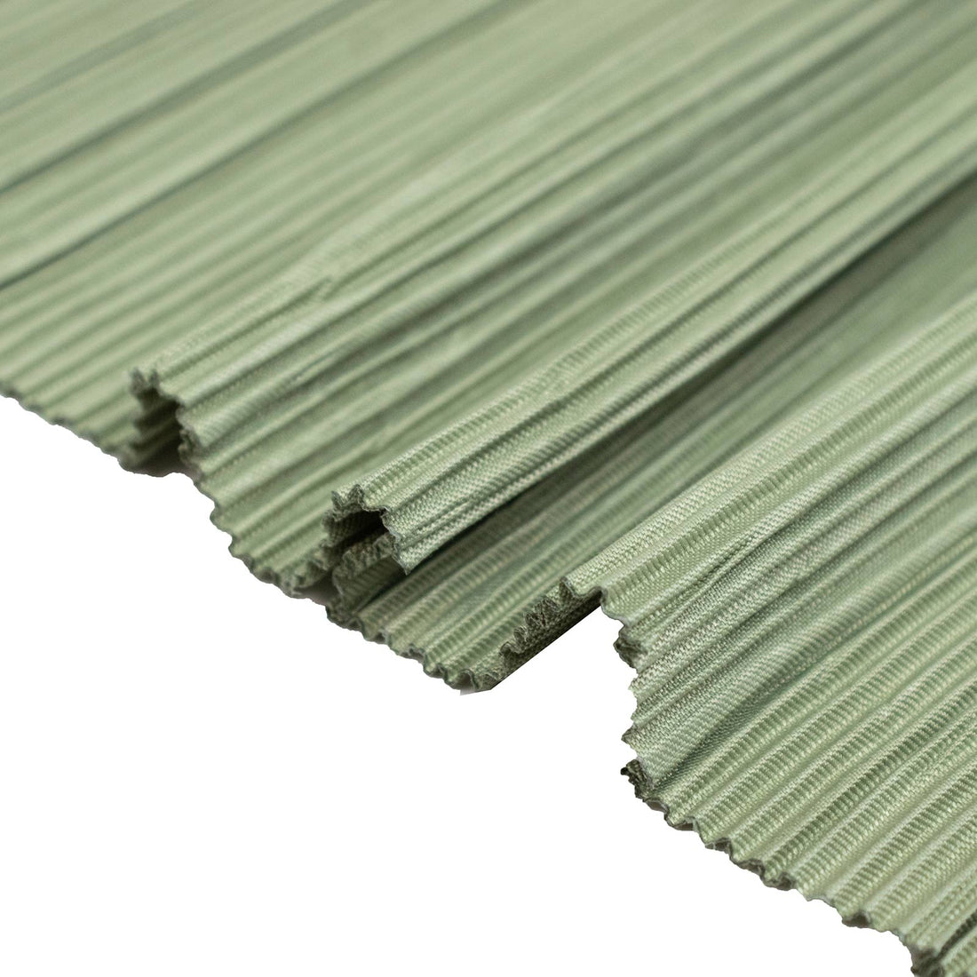 Green corrugated roofing sheet close-up with ribbed profile and cut edge