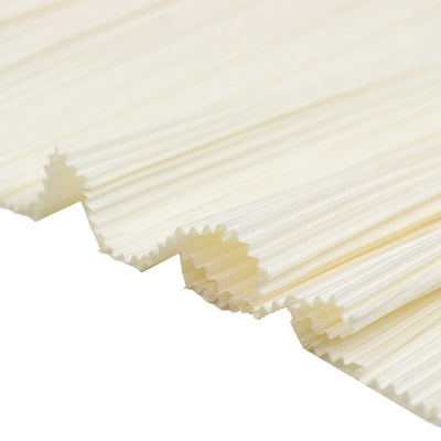 White pleated fabric filter media close-up with textured edges