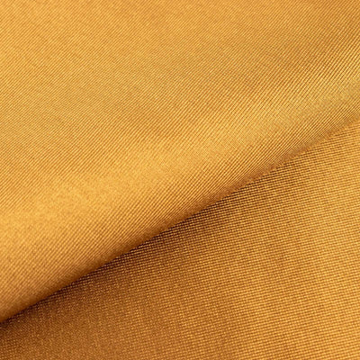 Textured golden fabric with a smooth surface.