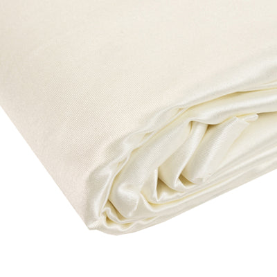 Cream-colored satin fabric roll, smooth texture and elegant sheen.
