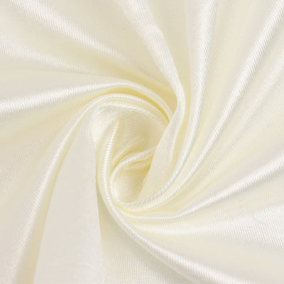 Silky cream fabric swirl for crafting and design projects.