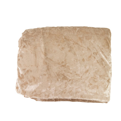 Soft beige blanket folded neatly on a plain background