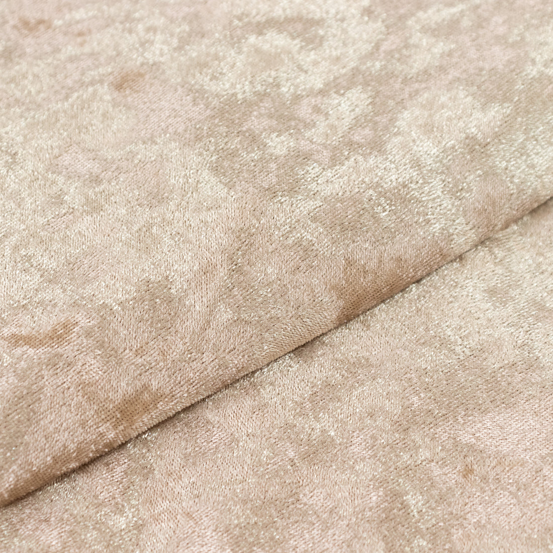 Textured beige fabric with a subtle floral pattern.
