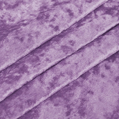 Purple velvet fabric texture with soft diagonal folds pattern