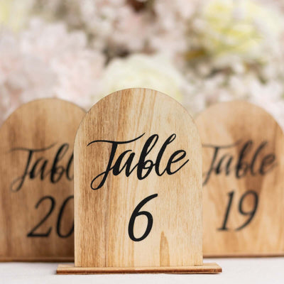 Wooden table number sign, elegant design, wedding decor.