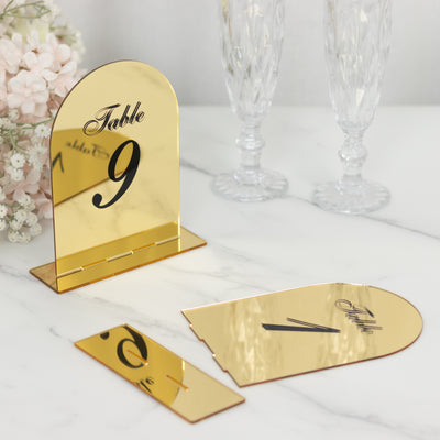Gold table number display with cutout design, elegant for events.