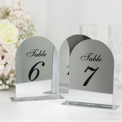 Mirrored table numbers 6 and 7 on a decorative table setting.