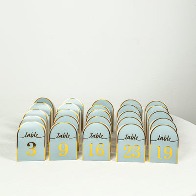 Table number cards in blue and gold, arranged in a row.