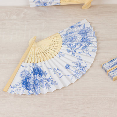 Blue floral patterned hand fan with wooden handle.