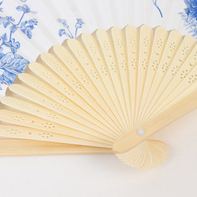 Elegant decorative fan with intricate design and soft colors