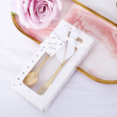 Gold fork and spoon set in a decorative box with a thank you tag.