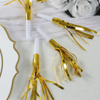 Gold foil party blowers on a white table setting.
