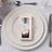 Elegant favor box with cutlery on a decorative plate setting.