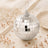 Silver mirrored disco ball ornament with elegant rose gold decor accents