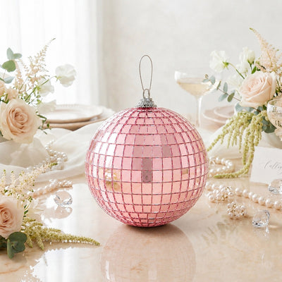 Pink disco ball ornament on elegant floral table setting