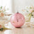 Pink disco ball ornament on elegant floral table setting