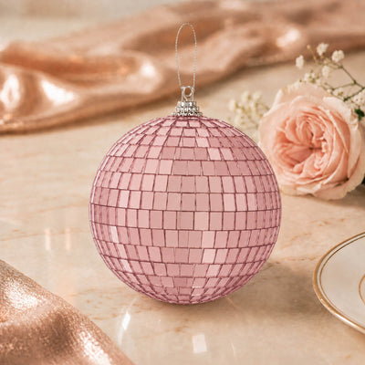 Pink mirrored disco ball Christmas ornament with rose floral background