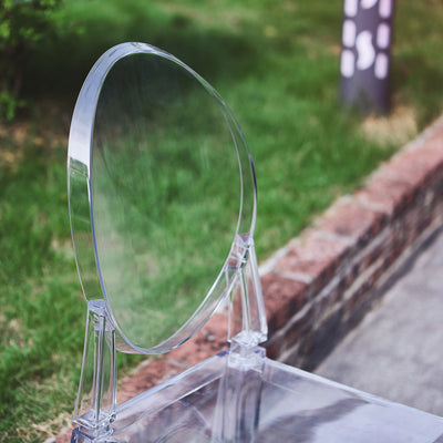 Acrylic circular mirror on a clear stand, showcasing modern design.