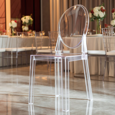 Transparent acrylic chair with modern design in elegant setting.