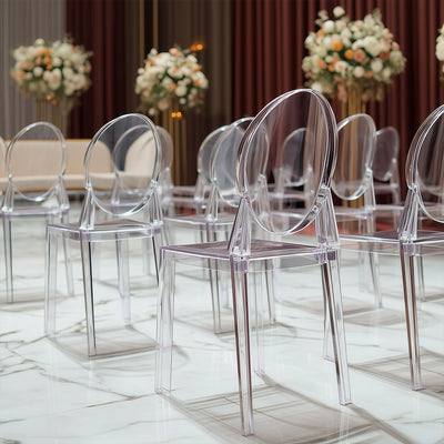 Transparent acrylic chairs arranged elegantly in a modern setting.