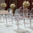 Transparent acrylic chairs arranged elegantly in a modern setting.