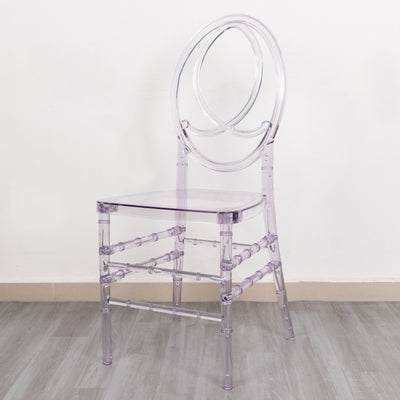 Clear acrylic chair with circular back design on plain background