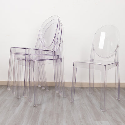 Stacked transparent chairs showcasing modern design