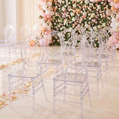 Clear acrylic wedding chairs with pastel floral backdrop and balloon decor