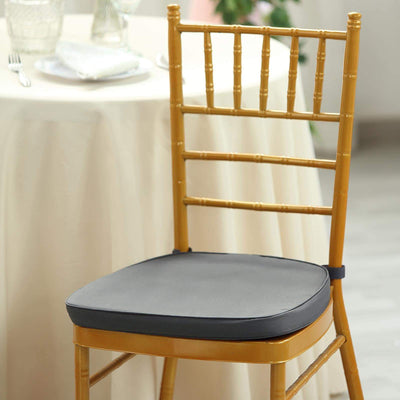 Gray chair cushion on a bamboo chair at a dining table.