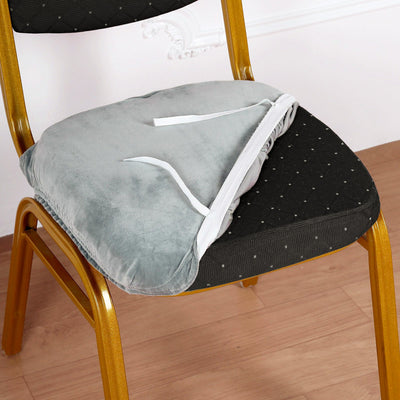 Soft chair cushion with ties for secure fit on a chair.