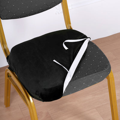 Black velvet chair cushion with zipper, perfect for added comfort and style.